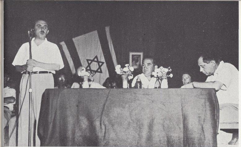 Moshe Sharett speaking at the 6th Agricultural Convention, Beit Hapoalim,Kfar Sava, 1945 Note picture of Berl Katznelson hanging beind the speakers